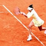 Garbiñe, durante su partido de octavos de final de Roland Garros ante Kuznetsova | Foto: EFE