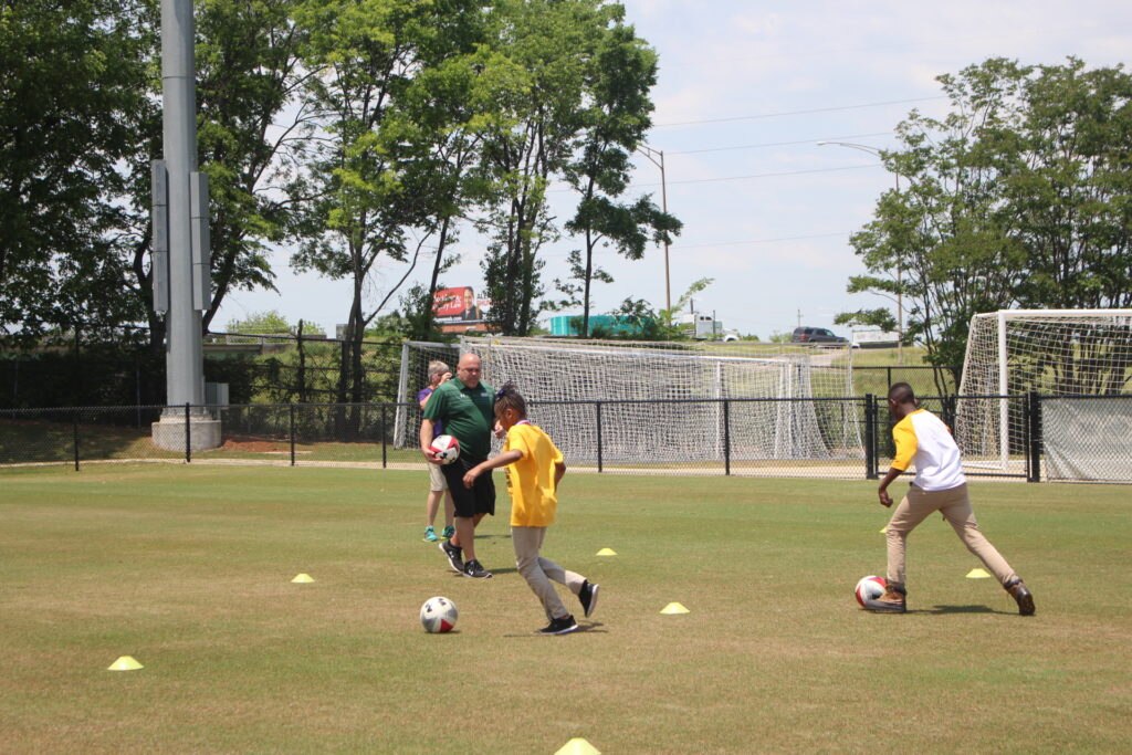 BBVA Compass, UAB and Legion FC host a youth soccer clinic for Glen Iris Elementary school students during the BBVA Compass Field Expansion celebration.