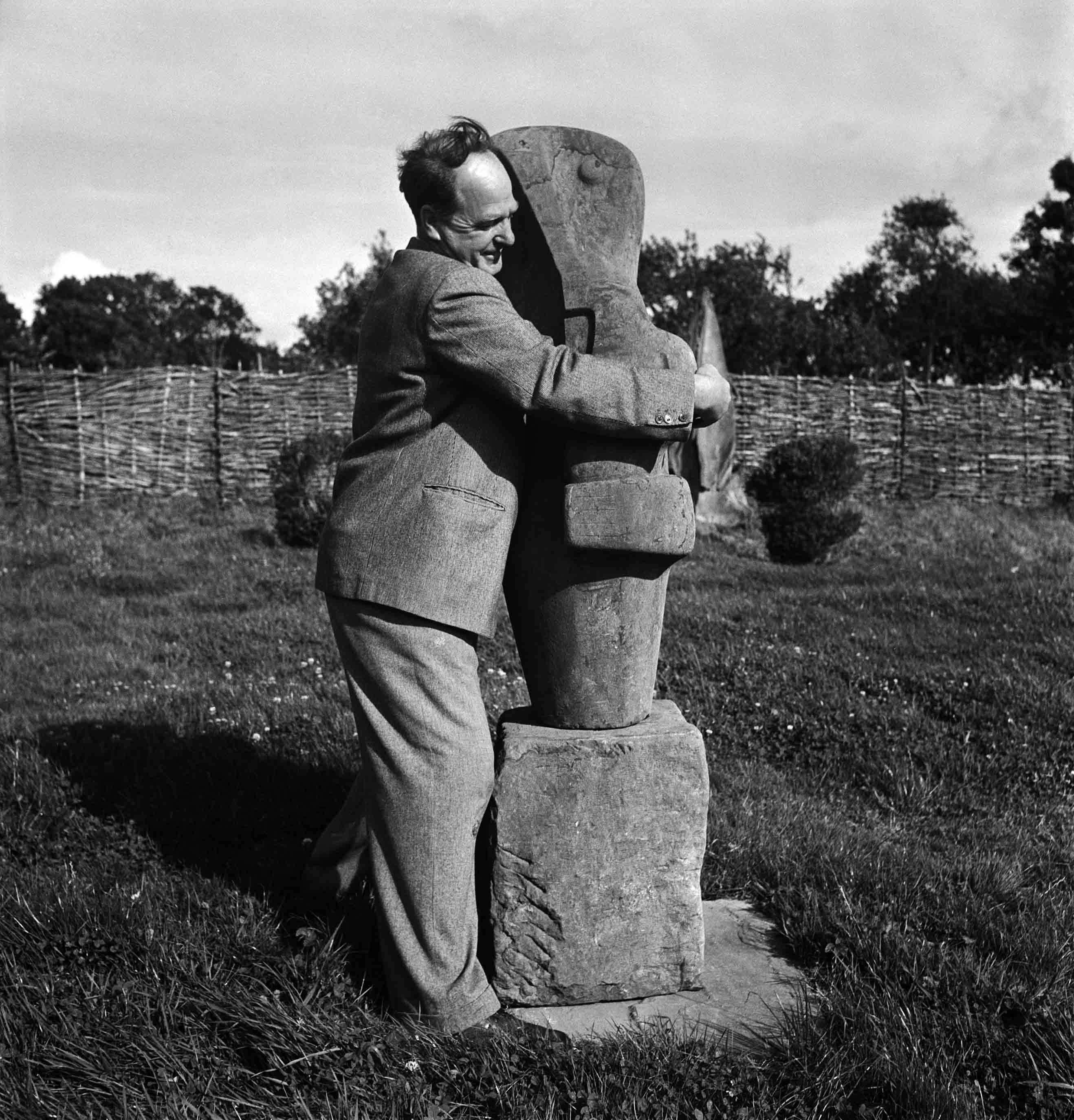 Henry Moore with his sculpture Mother and Child, Farley Farm, England, 1953 Henry Moore with his sculpture Mother and Child, Farley Farm, England, 1953