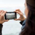 bbva recurso Woman taking pictures with phone bbva recurso Woman taking pictures with phone