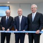From left, Francisco Gonzalez, Manolo Sanchez, and Jim Heslop perform a ribbon cutting at the BBVA in Houston 2013