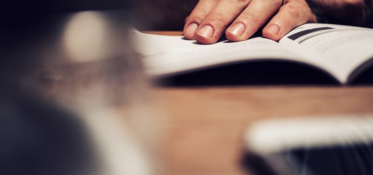 Man reading manual book bbvaMan reading manual book bbva