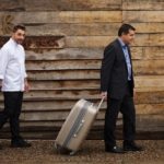 Picture of the Roca brothers with their suitcase BBVA