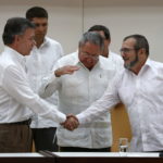 Image of President of Colombia, Juan Manuel Santos and head of FARC group Timoleón Jiménez - nicknamed Timochenko - announce from Cuba the signing on the transitional justice agreement before president Raúl Castro.