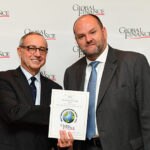 Alexis Thompson, Head of Global Securites Services, receiving the Best Custodian in Spain awards certificates from Global Finance Publisher and Editorial Director, Joseph Giarraputo.