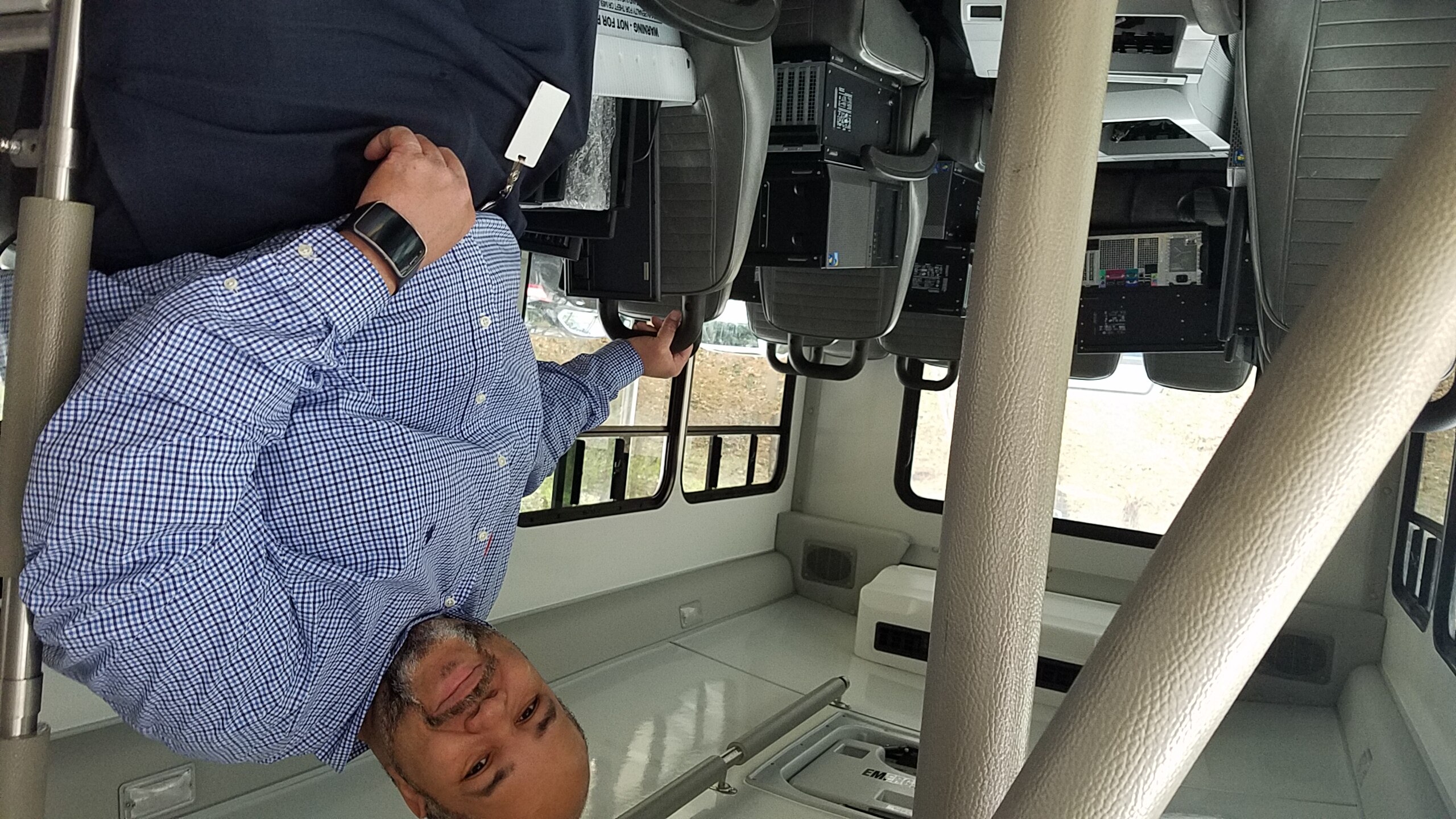 A photo of BBVA Compass Birmimgham Chapter Volunteer Kevin Cunningham loading computers and laptops for donation to the Houston Authority Birmingham District