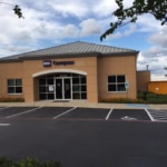 A photo of a BBVA Compass branch with an Amazon locker.