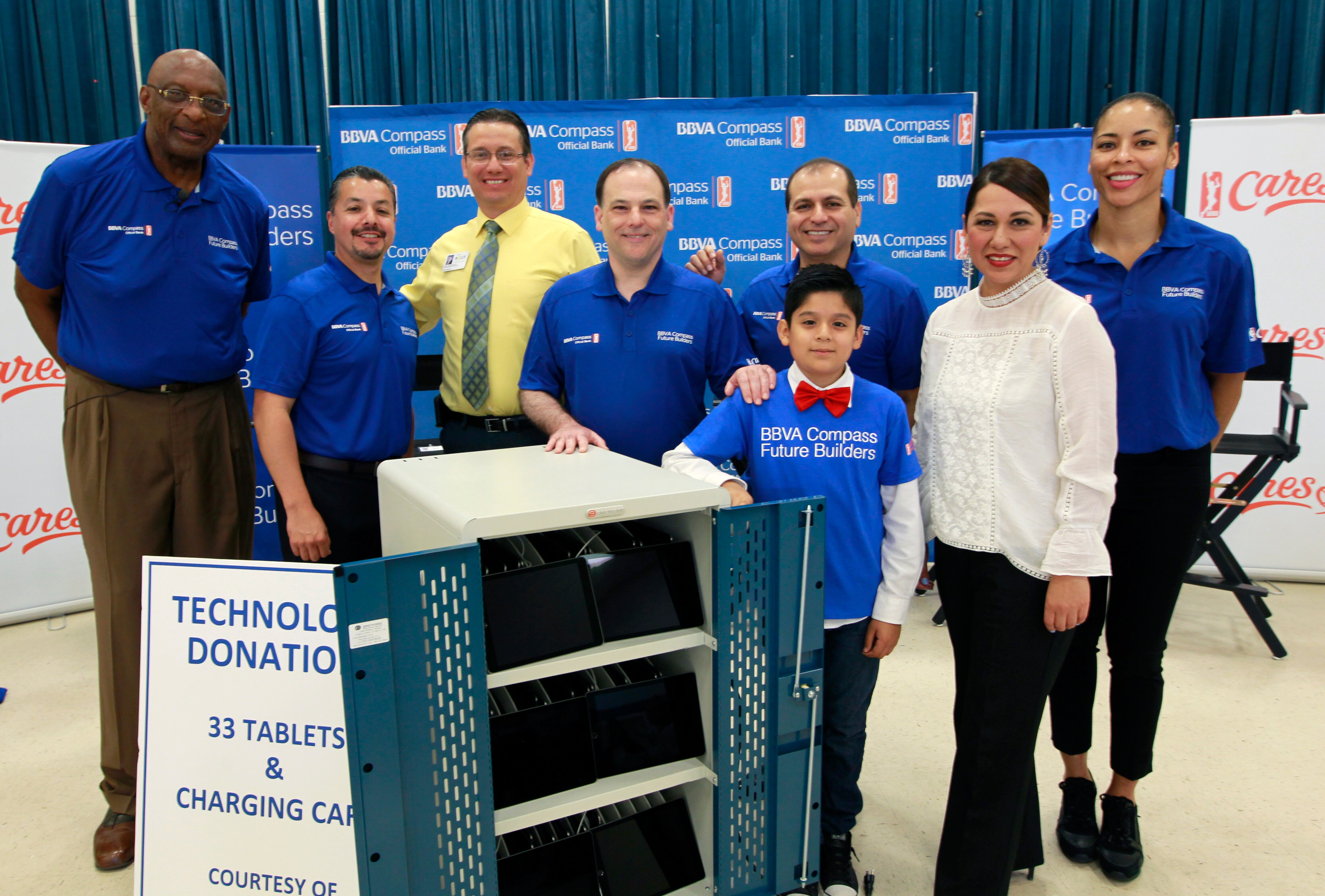 McALLEN, TX - APRIL 6: Bob Lanier, left, Jason Leal, J.A. Gonzalez, Jon Rebello, Rey Ocanas, Ramon Lander, below, Rosey Guerra and Allison Feaster pose with a technology donation at Victor Fields Elementary School in McAllen, Texas. BBVA Compass and WNBA Cares partnered to promote financial literacy to students at school, providing technology equipment and learning programs for social responsibility through financial literacy.
(NOTE TO USER: User expressly acknowledges and agrees that, by downloading and/or using this Photograph, user is consenting to the terms and conditions of the Getty Images License Agreement. Mandatory Copyright Notice: Copyright 2017 NBAE (Photo by Nathan Lambrecht/NBAE via Getty Images)