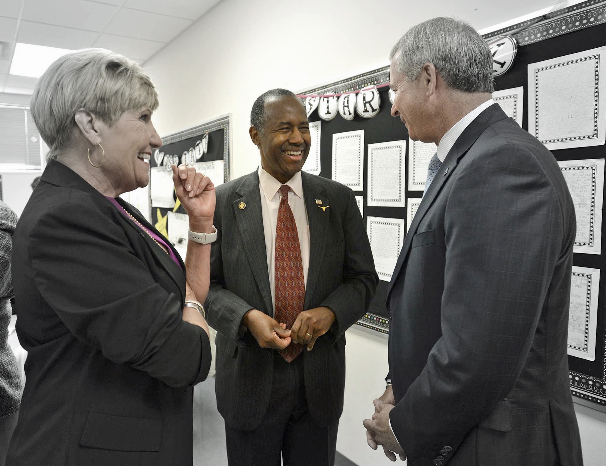 Fort Worth Mayor Betsy Price, HUD Secretary Ben Carson and BBVA Compass Fort Worth Market CEO Brian Happel.