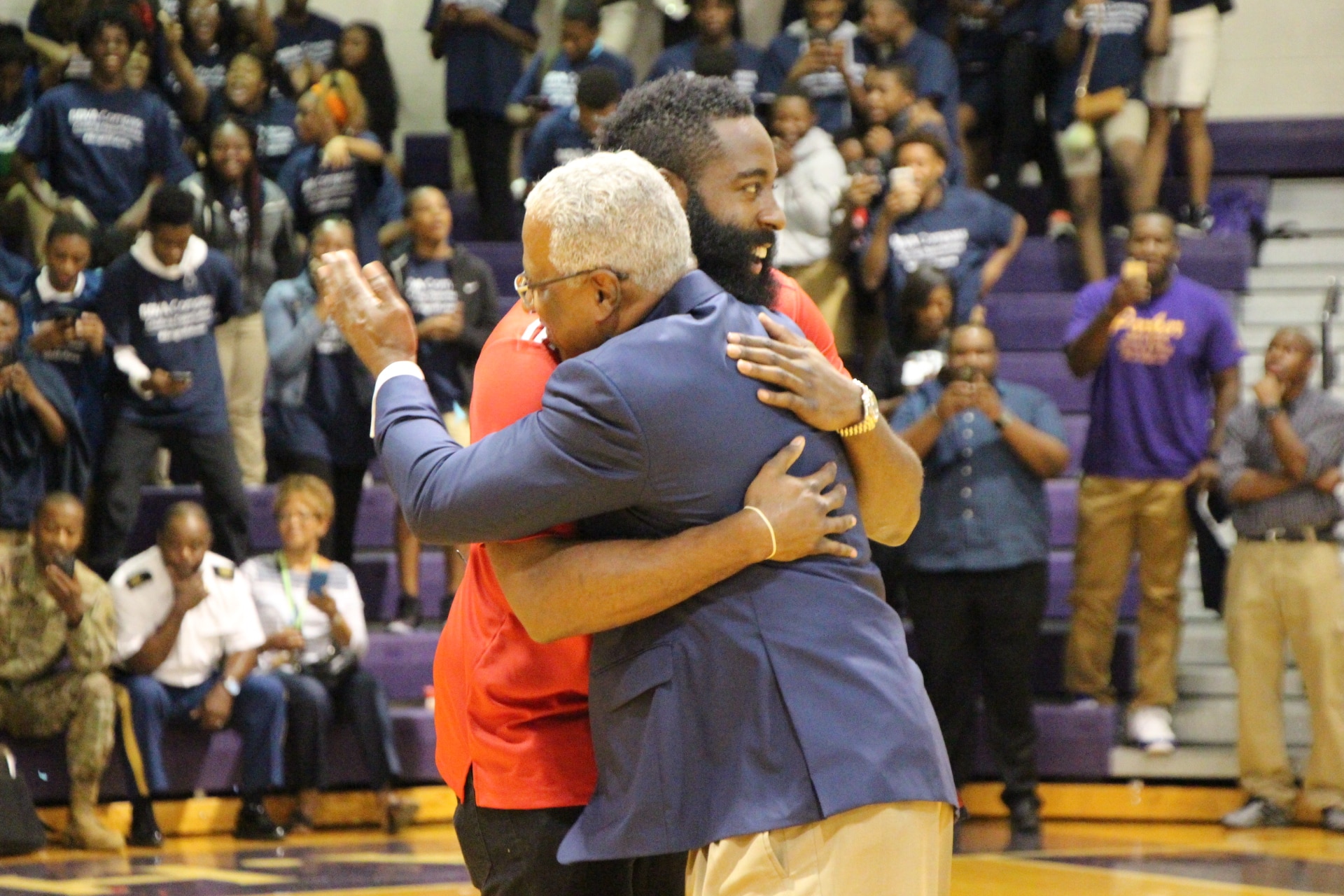 James Harden greets Birmingham Mayor William Bell as he makes a surprise appearance at Parker High School's prep rally in Birmingham, Ala. james-harden-and-birmingham-mayor-william-bell