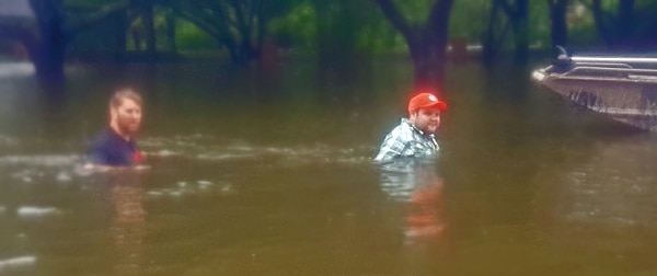 Through the blur of Harvey, a clear desire to help: Houston-area Retail Project Manager Ben Walker, right, partnered with friends and the Cajun Navy to rescue people in west Houston during Hurricane Harvey. bbvacompass-employee-hurricane-harvey