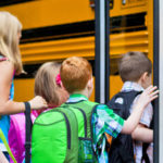 children-boarding-school-bus